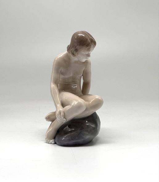 Antique figurine "Girl on the stone"