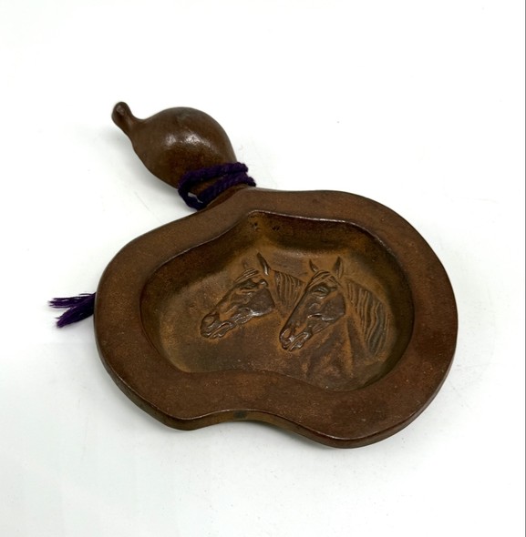 A vintage bronze gourd-shaped ashtray