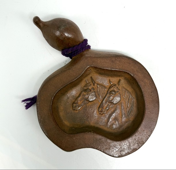 A vintage bronze gourd-shaped ashtray
