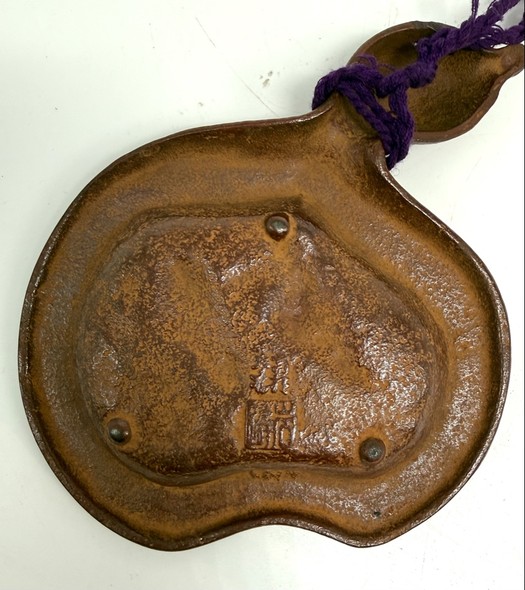 A vintage bronze gourd-shaped ashtray
