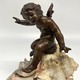Antique sculpture "Cupid on a Shell"