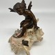 Antique sculpture "Cupid on a Shell"