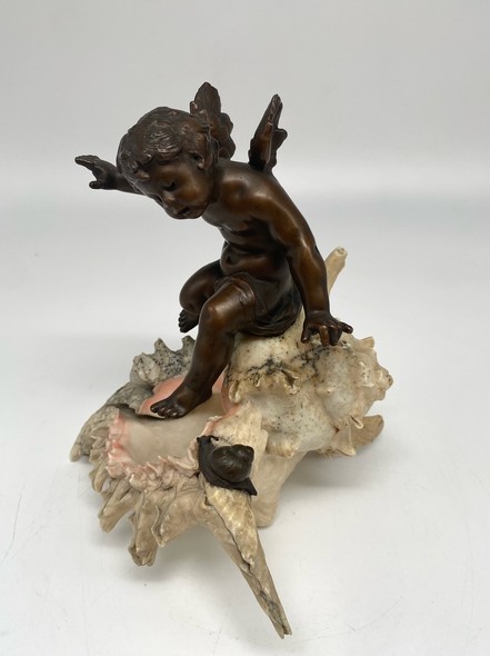 Antique sculpture "Cupid on a Shell"