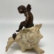 Antique sculpture "Cupid on a Shell"