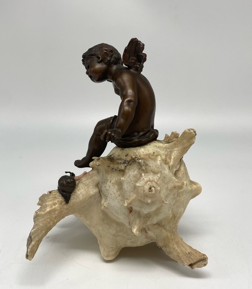 Antique sculpture "Cupid on a Shell"