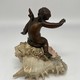 Antique sculpture "Cupid on a Shell"