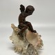 Antique sculpture "Cupid on a Shell"