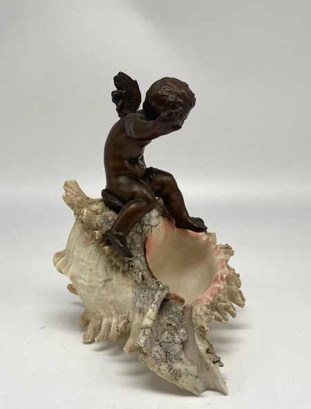 Antique sculpture "Cupid on a Shell"