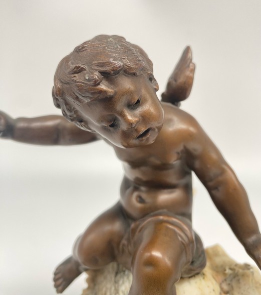 Antique sculpture "Cupid on a Shell"