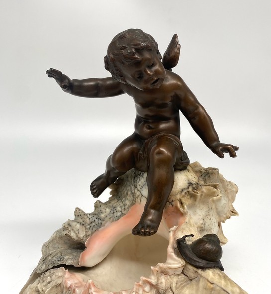 Antique sculpture "Cupid on a Shell"