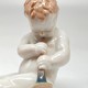 Antique sculpture of a little boy