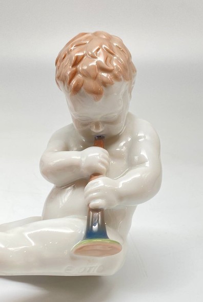 Antique sculpture of a little boy