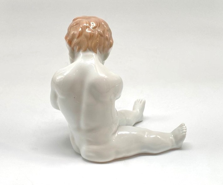 Antique sculpture of a little boy