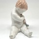 Antique sculpture of a little boy