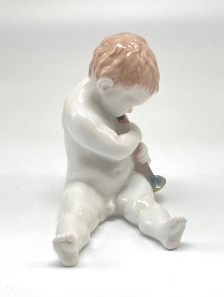 Antique sculpture of a little boy